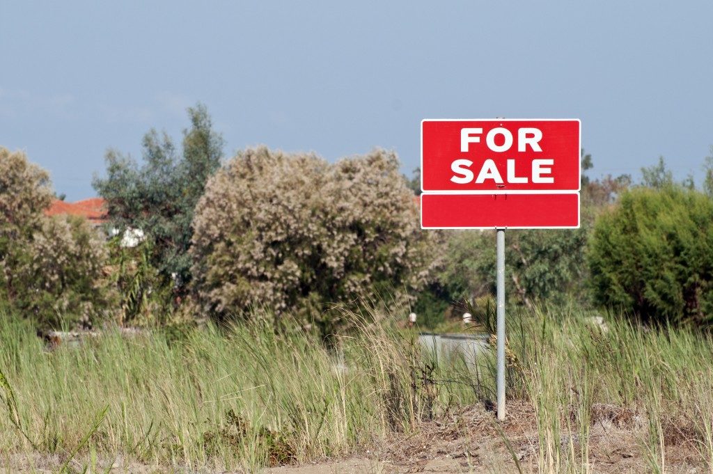 For sale sign on land
