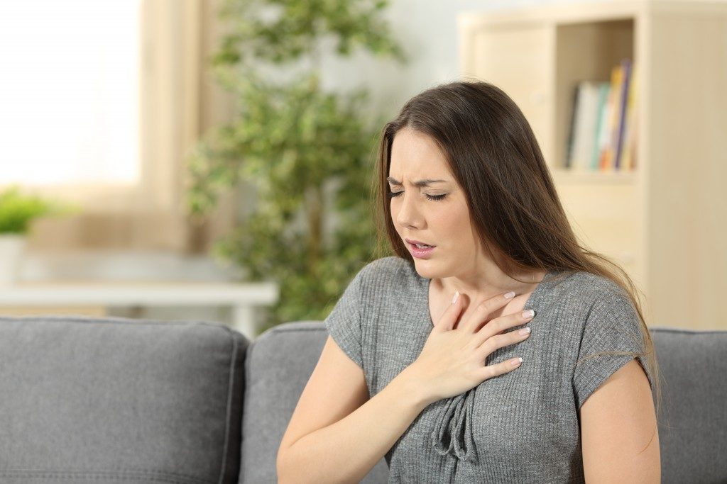 Woman finding it hard to breathe