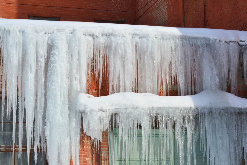 ice buildup on a entrance of a building during winter