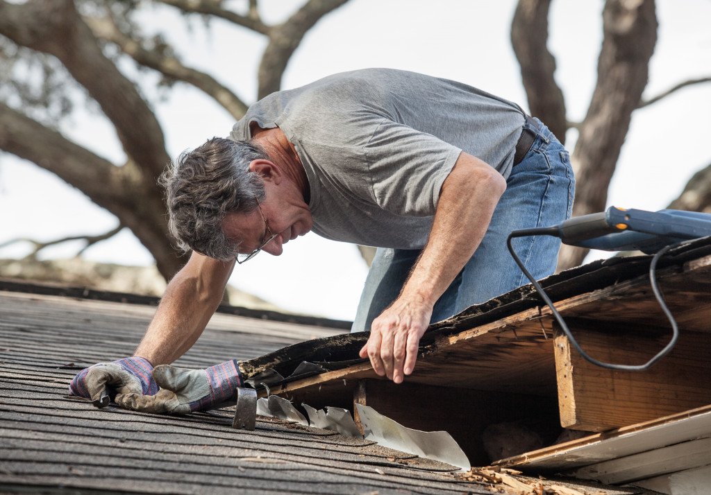 A worker inspecting a roof