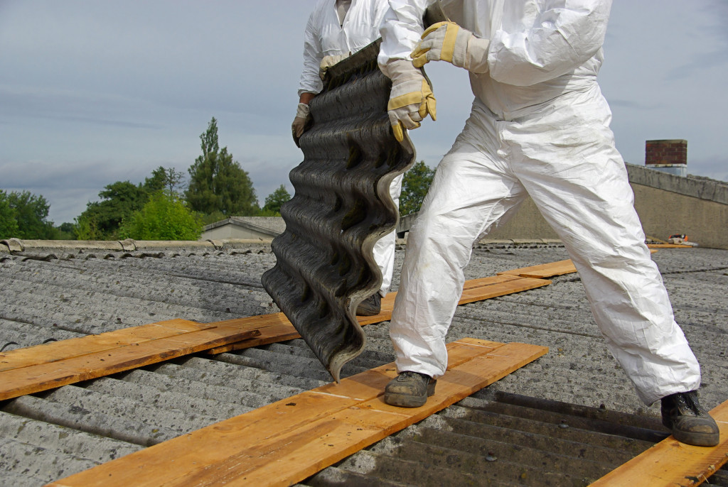 Two workers installing a roof
