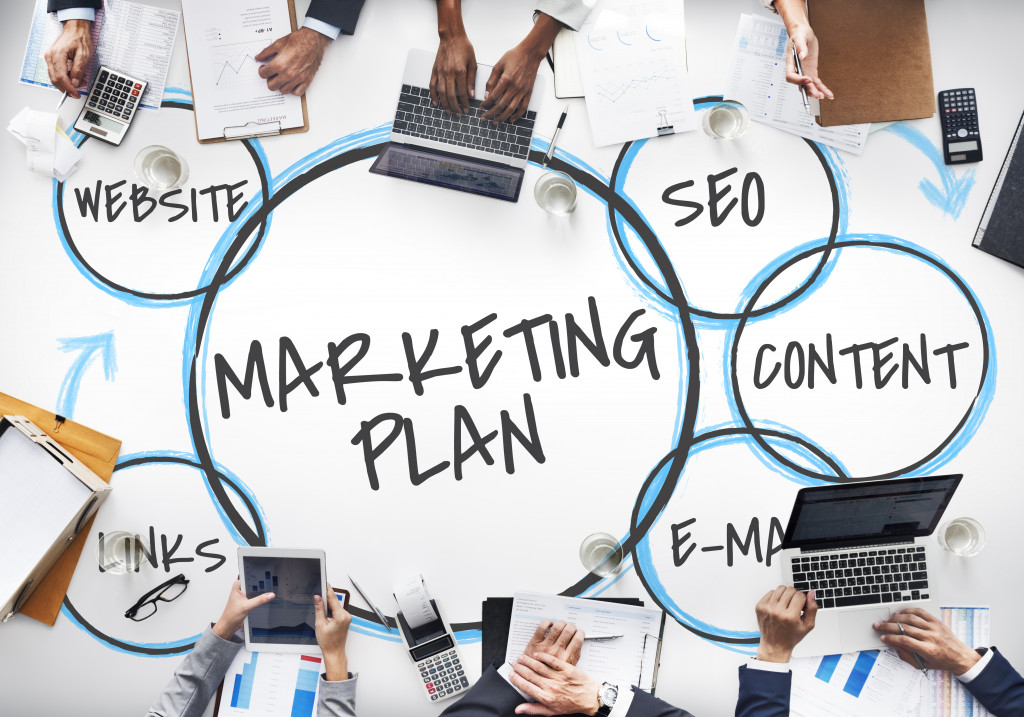 The words marketing plan in the middle of a diagram with other aspects of the plan around it, including SEO, links, email, content, and website.