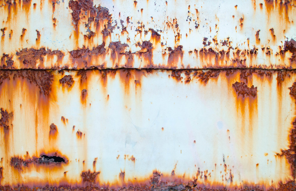A rusty and corroded metal sheet