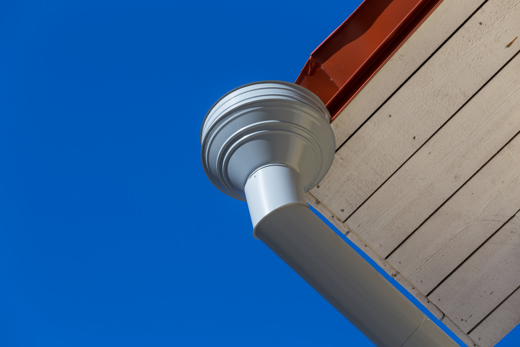 An image of a downspout in a rain gutter