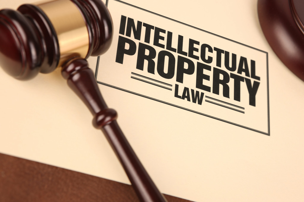 intellectual property law written or stamped on a brown paper with gavel on top