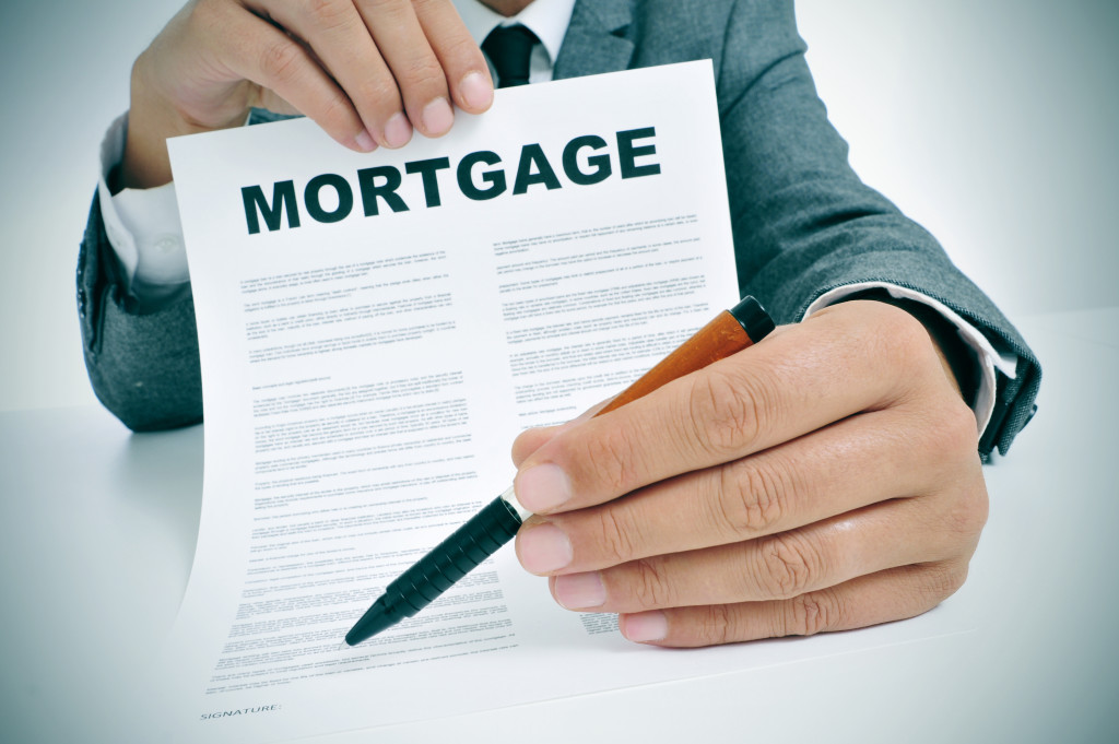 A mortgage document with pen