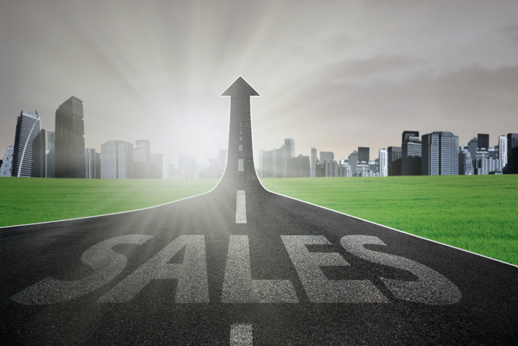 sales written in road with upward direction